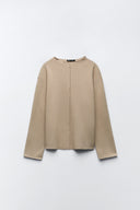Sweater with a subtle front seam