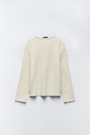 Sweater with a subtle front seam