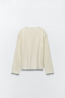 Sweater with a subtle front seam