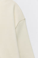 Sweater with a subtle front seam