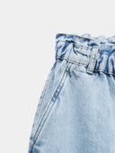 Elevated-rise, loose-fitting paperbag jeans with a high waist.
